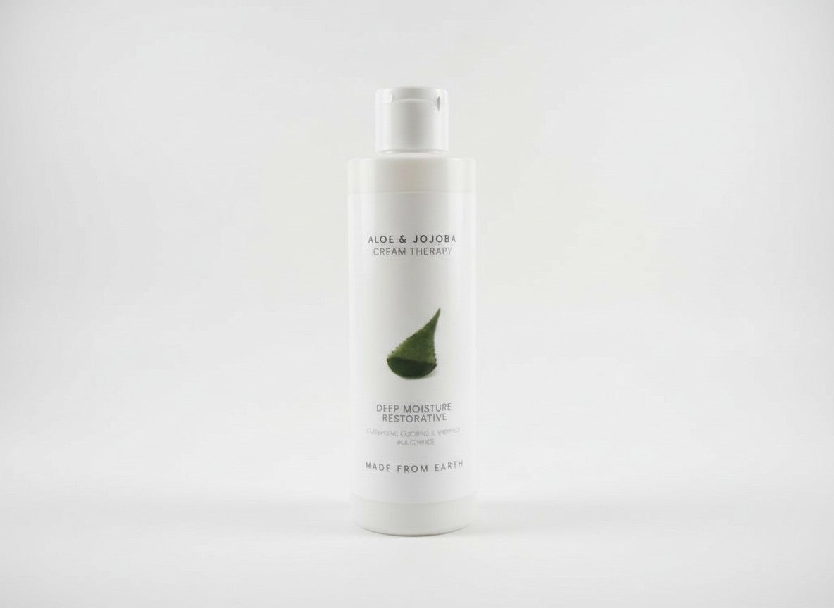 Made from Earth Aloe & Jojoba Cream Therapy Deep Moisture Restorative lotion bottle with aloe leaf graphic.